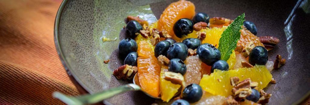 bowl of fresh fruit and nuts