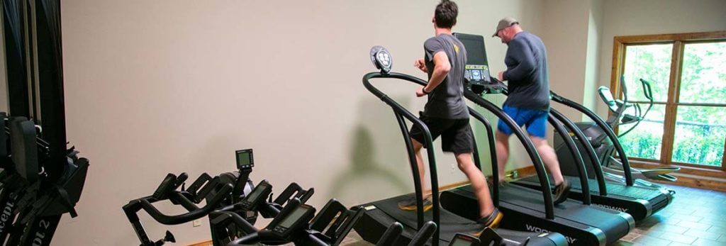 men running on woodway treadmills