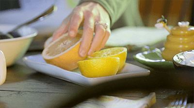 holding grapefruit half