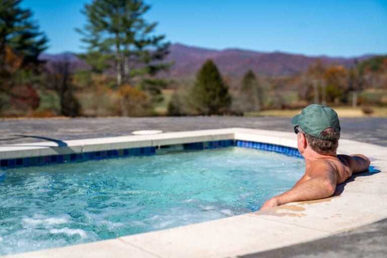 Man in hot tub on Skyterra Wellness campus
