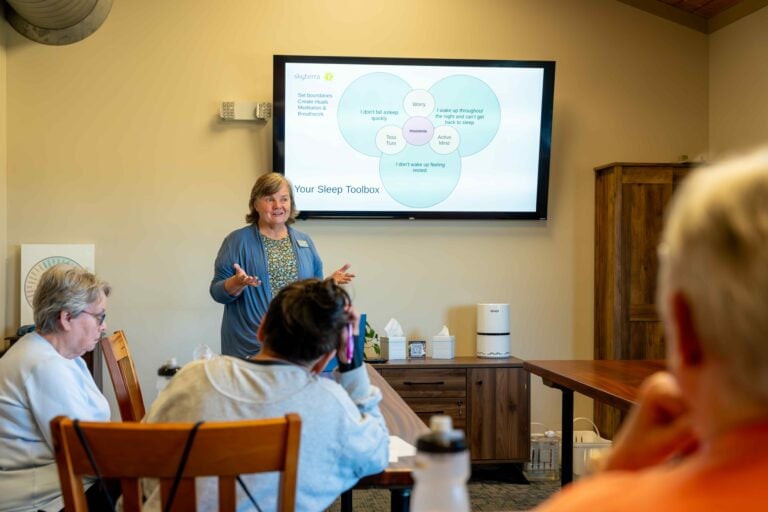 Guests attending a presentation in a classroom